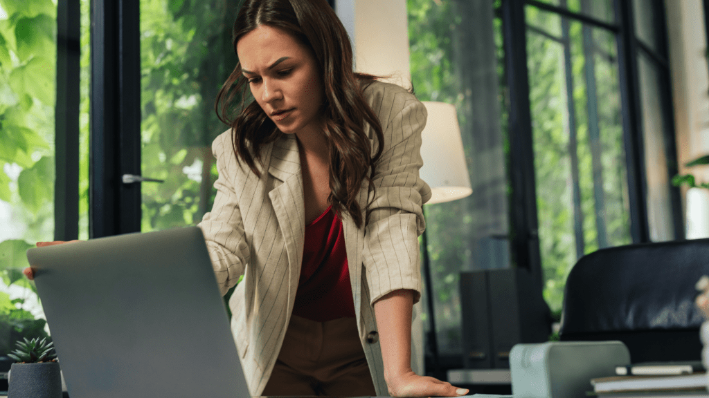 Concerned woman looking at a laptop